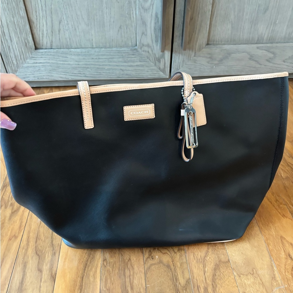 Coach Black and Tan Tote Bag with Minimalist Design